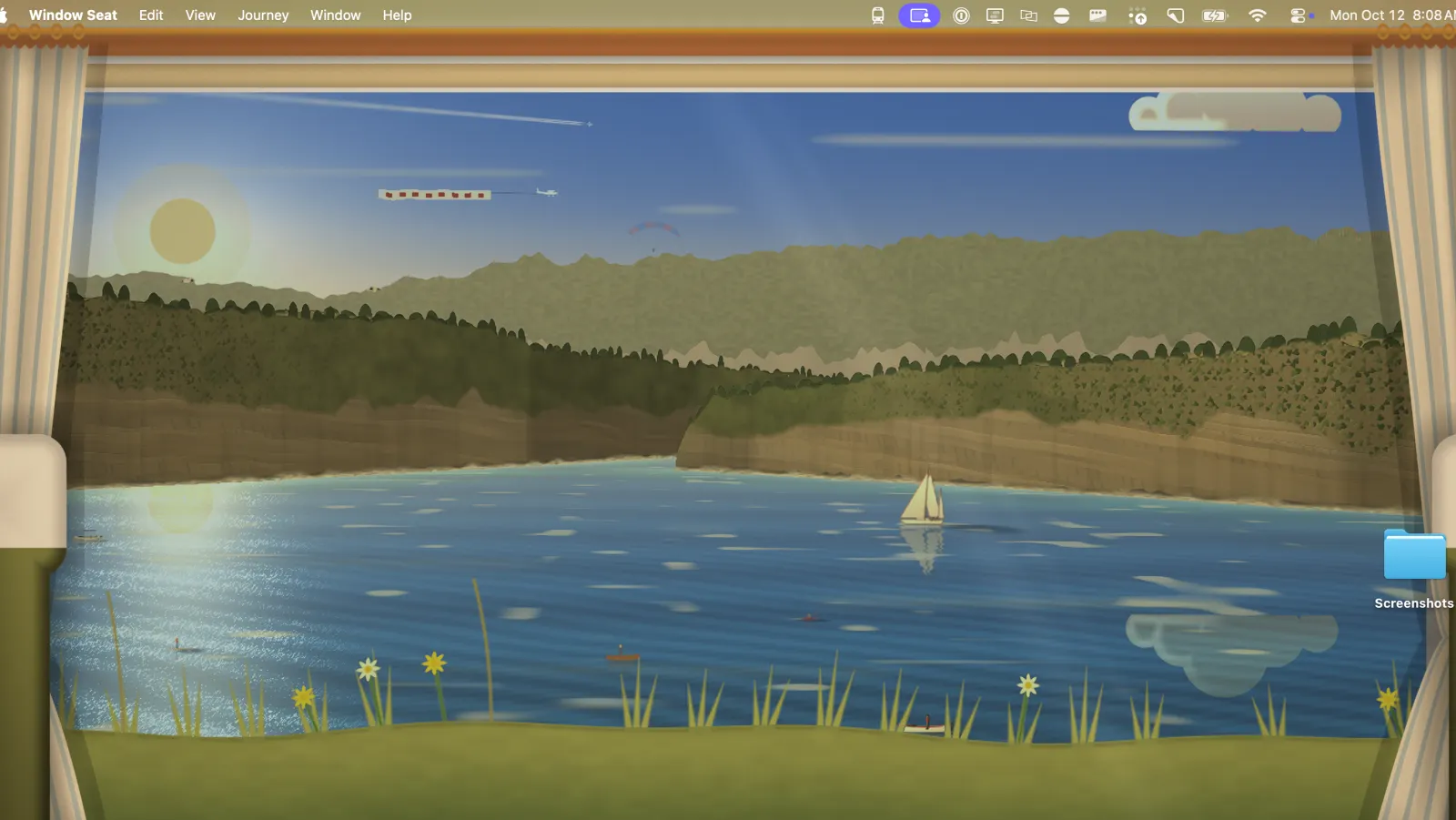 A Mac desktop filled with the view from a train on the Riviera, a sailboat on the sea under the menu bar.